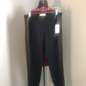 Michael Kors nwt navy leggings with faux leather brown accent down the sides.